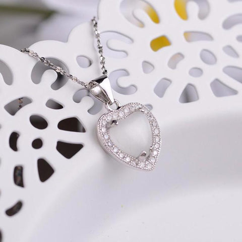 Ella heart shaped white crystal sterling silver micro setting pendant